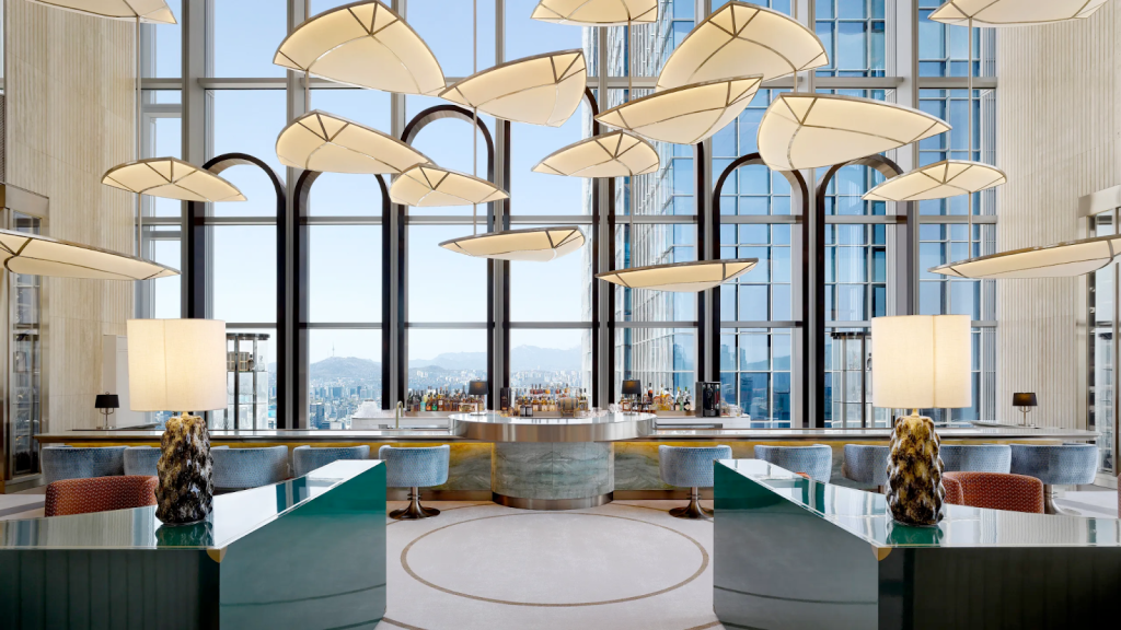 Modern high-rise bar with unique overhead lighting fixtures.