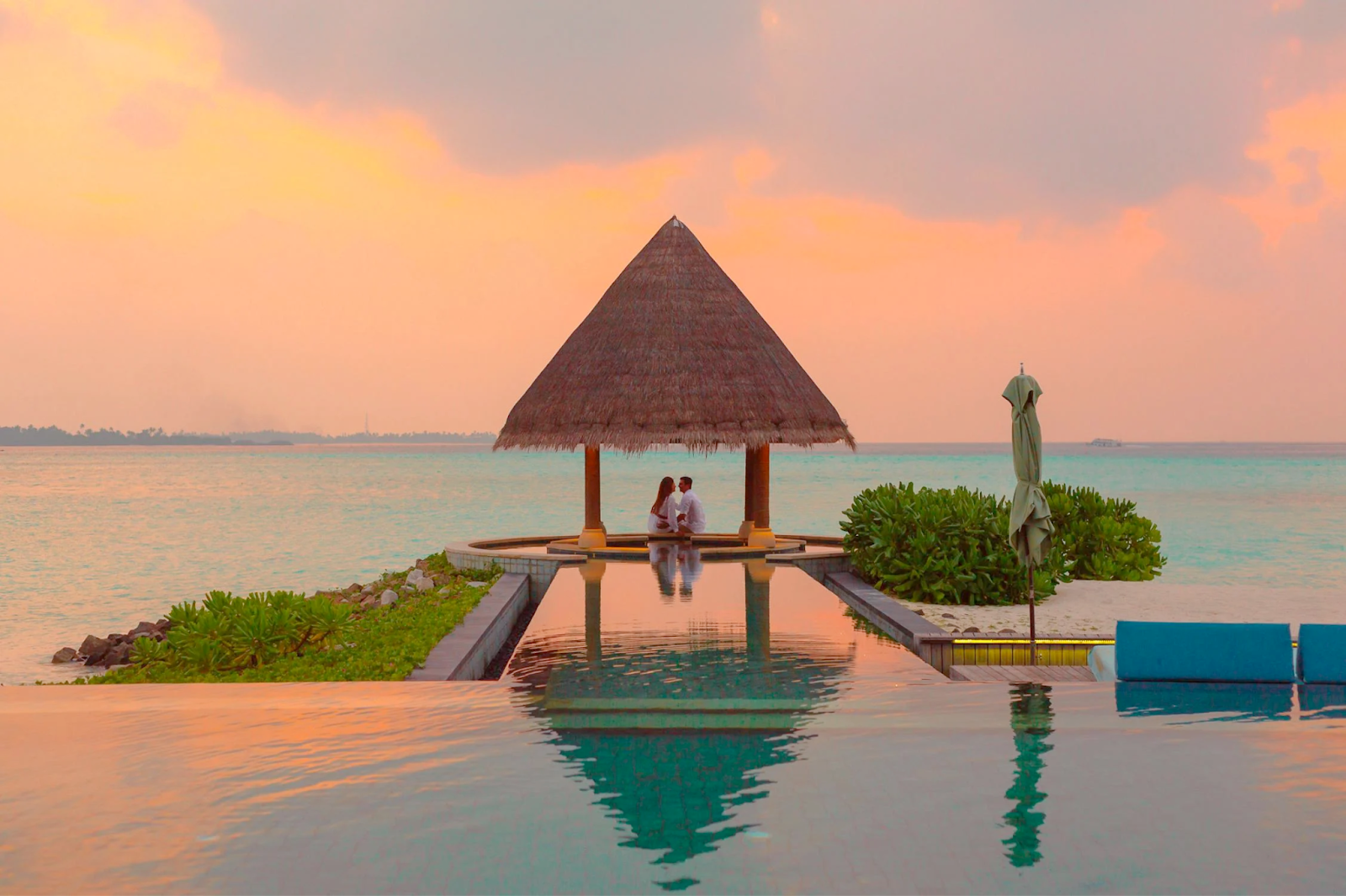 A couple on their honeymoon looking over the water