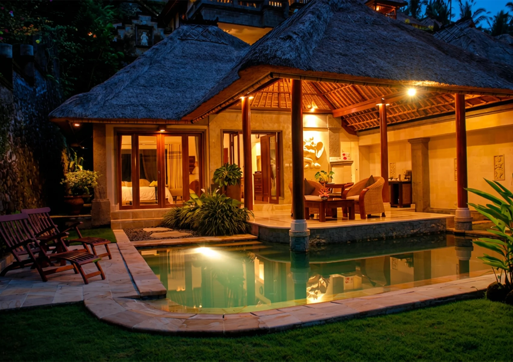 Luxury Elephant Villa at Viceroy Bali with a private pool, traditional Balinese architecture, warm evening ambience, and a secluded romantic setting for couples in the jungle valley of Ubud